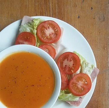Picture of a bowl of squash and pepper soup in a bowl, with ham salad sandwich thins on a plate, as the first day of my WeightWatchers frugal weight loss diet
