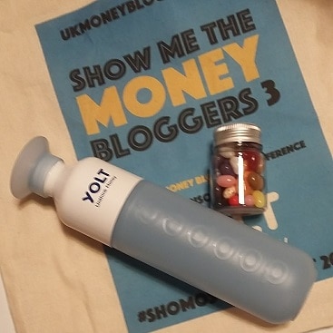Picture of SHOMOS money blogger conference goody bag which included water bottle and jelly beans