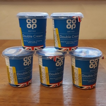 Picture of five 300ml pots of double cream, bought from the reduced section when I made buttter