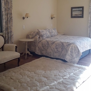 PIcture of a bedroom at my mother's bed and breakfast with white bedding