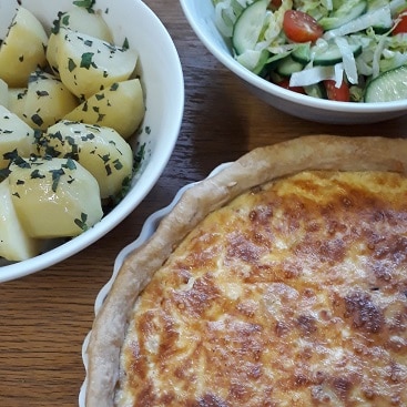 Picture of the quiche, potatoes and salad using Sourced Locally shopping