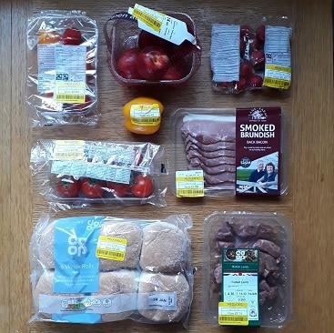 Picture of yellow stickers food shopping for my post on how we cut food costs in January