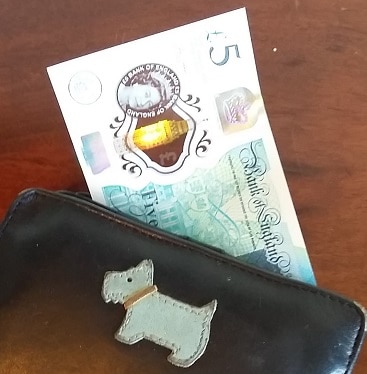 Picture of a fiver in a purse for my post on 10 ways to find money in a hurry before payday