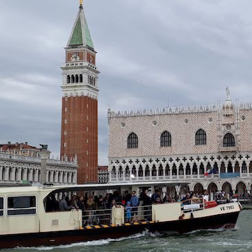Picture of a vaporetto or water bus with St Mark's Campanile and the Doge's Palace in the background
