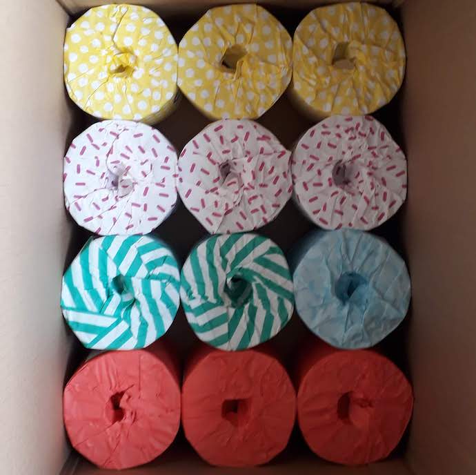 Picture of loo rolls wrapped in colourful paper