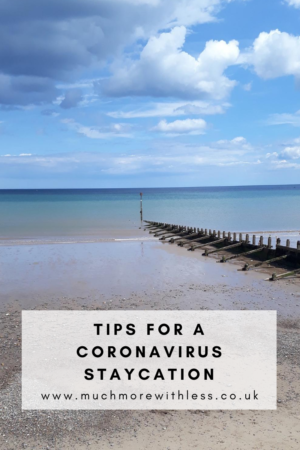 Pinterest sized image of Hornsea beach and blue skies for my post with tips for a coronavirus staycation